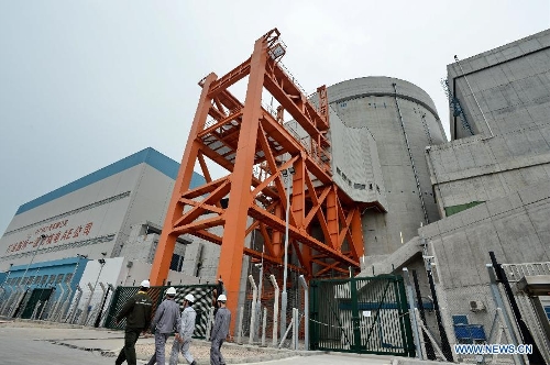 Employees walk in the Ningde Nuclear Power Plant in Ningde, southeast China's Fujian Province, April 18, 2013. The nuclear power plant made its generator No. 1 begin operating on Thursday, making it the first of its kind in the province. Ningde nuclear power plant, with four generators in the first phase of construction, is co-funded and jointly run by Guangdong Nuclear Power Group, Datang International Power Generation Co. Ltd., and Fujian Energy Group Co. Ltd. (Xinhua/Zhang Guojun)