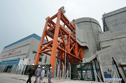 Employees walk in the Ningde Nuclear Power Plant in Ningde, southeast China's Fujian Province, April 18, 2013. The nuclear power plant made its generator No. 1 begin operating on Thursday, making it the first of its kind in the province. Ningde nuclear power plant, with four generators in the first phase of construction, is co-funded and jointly run by Guangdong Nuclear Power Group, Datang International Power Generation Co. Ltd., and Fujian Energy Group Co. Ltd. (Xinhua/Zhang Guojun) 