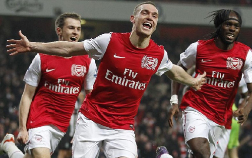 Arsenal's Thomas Vermaelen celebrates scoring his goal during their English Premier League match against Newcastle United at the Emirates Stadium in London. Vermaelen's dramatic added-time winner moved Arsenal to within one point of third-placed Tottenham Hotspur after a 2-1 victory. Photo: Xinhua/AFP