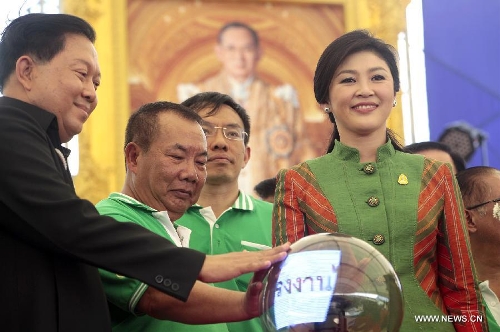 Thai Prime Minister Yingluck Shinawatra (1st R) attends a Labour Day celebration in Bangkok, capital of Thailand, May 1, 2013. (Xinhua/Rachen Sageamsak)