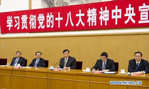Liu Yunshan (C), a member of the Standing Committee of the Political Bureau of the Communist Party of China (CPC) Central Committee and member of the Secretariat of the CPC Central Committee, attends a meeting on a campaign to promote the spirit of the 18th CPC National Congress in Beijing, capital of China, November 22, 2012. Xi Jinping, general secretary of the CPC Central Committee, gave a written instruction to Thursday's meeting. (Xinhua/Huang Jingwen)