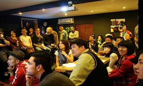 Competitors watch short films from last year at the kick-off party of this year's Shanghai 48 Hour Film Project.