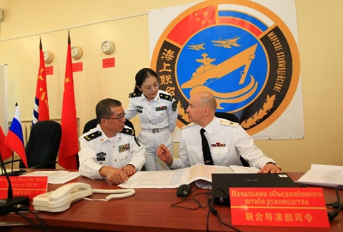 Directors of the joint naval drills work at the headquarters in Vladivostok, Russia, July 8, 2013. China and Russia started on Monday the joint naval drills off the coast of Russia's Far East. (Xinhua/Zha Chunming)  