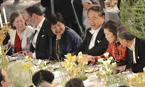 Chinese writer and Nobel Prize in Literature winner Mo Yan (3rd R) and his wife Du Qinlan (3rd L), Chinese Ambassador to Sweden Lan Lijun (1st R) and his wife Gu langlin (2nd R) attend an evening reception after Mo received Nobel Prize in Literature from Sweden's King Carl XVI Gustaf at the 2012 Nobel Prize ceremony in Stockholm, Sweden, December 10, 2012. Photo: Xinhua
