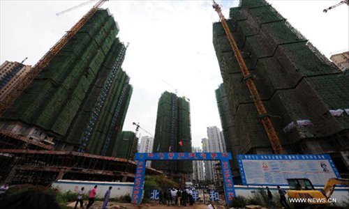 Photo taken on Sept 13, 2012 shows the accident site of a building under construction in central China's Hubei Province. Nine people were killed after a lift crashed from the 30th floor of the building Thursday. Photo: Xinhua 