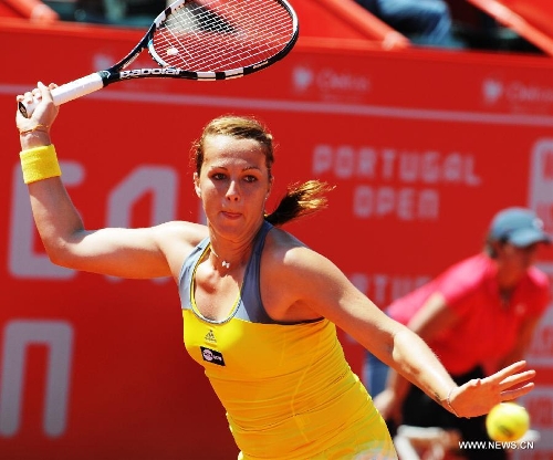 Anastasia Pavlyuchenkova of Russia hits a return during the women's singles final match against Carla Suarez Navarro of Spain at the 2013 Portugal Open in Lisbon, Portugal, May 4, 2013. Pavlyuchenkova won 2-0 to claim the title. (Xinhua/Zhang Liyun) 