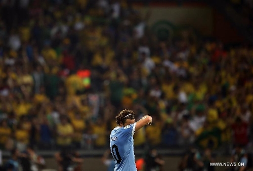 Uruguay's Diego Forlan reacts after the FIFA's Confederations Cup Brazil 2013 semifinal match against Brazil, held at Mineirao Stadium, in Belo Horizonte, Minas Gerais state, Brazil, on June 26, 2013. (Xinhua/Liao Yujie)