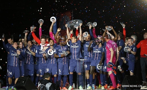 Paris Saint-Germain's players celebrate during the celebration for winning the French League 1 title after the League 1 football match between Paris St Germain and Brest at Parc des Princes stadium in Paris on May 18, 2013. (Xinhua/Wang Lili)