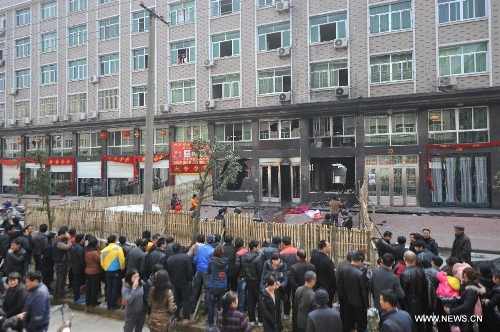 Photo taken on Feb. 23, 2013 shows a fire-stricken residential building in Muxi Village of Zeguo Town, Wenling, east China's Zhejiang Province. A fire that broke out here early Saturday morning has killed eight people before it was put out an hour later. Wenling's fire department said the fire occurred at 2:59 a.m. (1859 GMT) and burnt three residential houses in Zeguo Town. An investigation is underway. (Xinhua/Huang Zongzhi) 