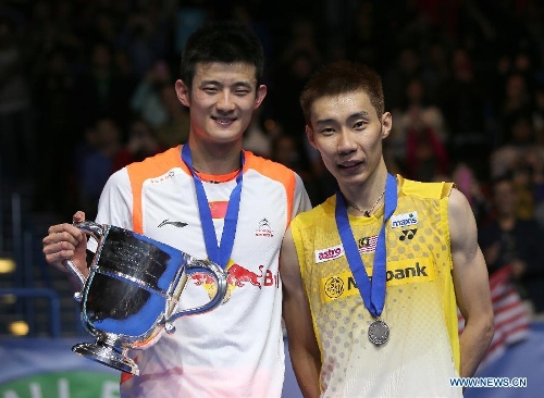 China's Chen Long(L) poses at the awarding ceremony with Malaysia's Lee Chong Wei after their singles final match at the 2013 Yonex All England Open Badminton Championships, in Birmingham, Britain, March 10, 2013. Chen Long won 2-0 to claim the titel.(Xinhua/Yin Gang)