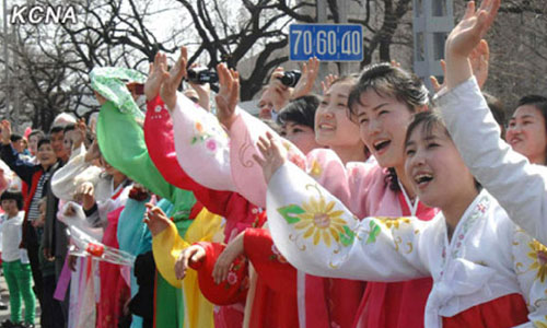 Local citizens waved at the troops taking part in the military parade commemorating the 100th birth anniversary of Kim Il Sung's birth on April 15, 2012. Photo: KCNA