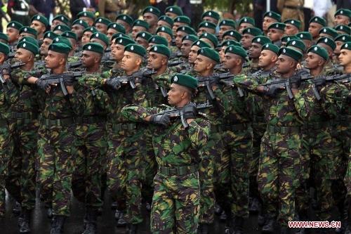 Soldiers participate in a military parade to celebrate Sri Lanka's 65th Independence Day in Trincomalee, Sri Lanka, Feb. 4, 2013.(Xinhua/Pushpika Karunaratne)