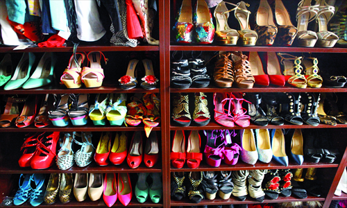 A Beijing woman's wardrobe contains an extravagant collection of brand-name shoes. Photo: Guo Yingguang/GT