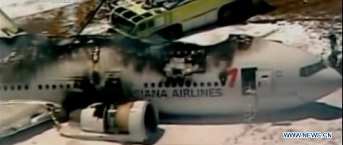 The video grab shows the wreckage of Asiana Airlines Boeing 777 airplane at San Francisco International Airport, California, the United States, on July 6, 2013. Two people were confirmed dead in Saturday's crash landing of an Asiana Airlines Boeing 777 passenger plane originated from Seoul, the Republic of Korea (ROK), at San Francisco International Airport, said San Francisco Fire Chief Joanne Hayes-White at a press conference. She also said 82 people injured were transported to local hospitals. (Xinhua)
