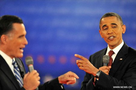 US President Barack Obama (R) and Republican presidential nominee Mitt Romney attend the second presidential debate at Hofstra University in Hempstead, New York state, the United States, October 16, 2012. (Xinhua/Wang Lei)