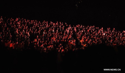 Audiences to the Strawberry Music Festival are seen in Beijing, capital of China, April 29, 2013. The three-day 2013 Strawberry Music Festival kicked off here on Monday, attracting more than 160 music bands from across the world to perform on stages of eight different styles. (Xinhua/Yao Jianfeng)