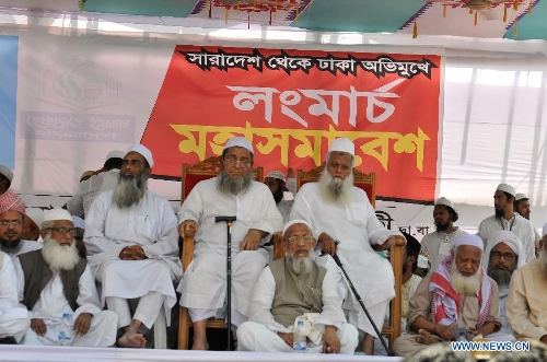 Hefazat-e-Islam top leaders sit on a stage during a grand rally at Motijheel area in Dhaka, Bangladesh, April 6, 2013. Tens of thousands of Islamists under the banner of Hefazat-e-Islam from across Bangladesh poured into the key commercial hub of the capital city to join a grand rally, demanding action against the 