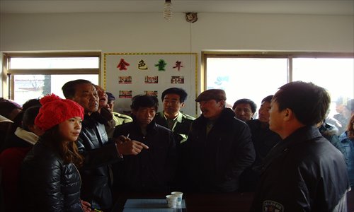 Villagers of Panguanying in Hebei Province confront the county police chief (first on the right) after the botched election. Photo: Liu linlin/GT