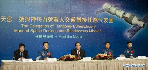 Astronauts, key commanders and designers of China's manned space program attend a press conference in South China's Hong Kong, August 10, 2012. A 40-plus-member delegation of Tiangong-1/Shenzhou-9 Manned Space Docking and Rendezvous Mission, including three astronauts who had fulfilled China's first manned space docking mission this June, arrived at Hong Kong Friday for a four-day visit. Photo: Xinhua
