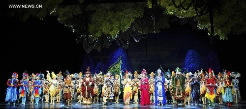 Dancers perform in the rehearsal of the musical Hundred-bird Dress in Nanning, capital of south China's Guangxi Zhuang Autonomous Region, April 27, 2013. The musical tells a legend of the Zhuang ethnic group about a young hero's sacrifice in protecting the homeland against an evil polluting power. (Xinhua/Liu Jun) 