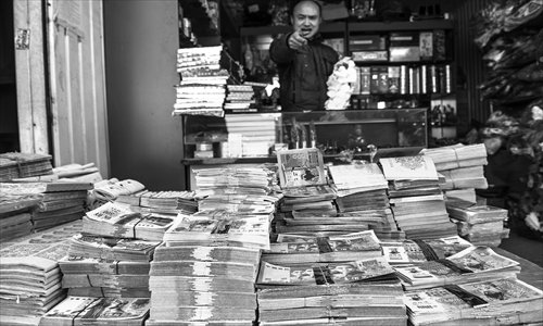 A vendor sells paper offerings in a market in Shijingshan district. Photo: Li Hao/GT