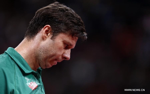 Vladimir Samsonov of Belarus reacts during men's singles round of 16 against Matsudaira Kenta of Japan at the 2013 World Table Tennis Championships in Paris, France on May 18, 2013. Vladimir Samsonov lost 3-4. (Xinhua/Wang Lili) 