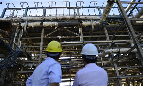 Technicians inspect the site of an explosion at a controversial chemical plant in Zhangzhou, Fujian Province on July 30. Photo: CFP