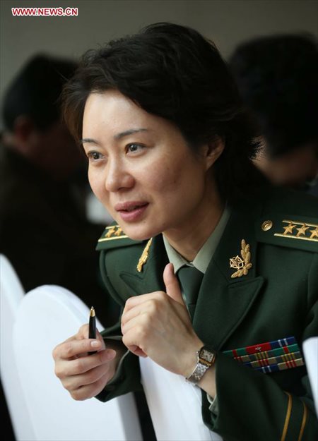 Lei Min, a member of the 12th National Committee of the Chinese People's Political Consultative Conference (CPPCC), who serves in a training school for armed police, expresses her concern on young people's physical condition in Beijing, capital of China, March 7, 2013. Women's presence in China's politics has been increasing in recent decades. The number of female deputies to the 12th National People's Congress and members of the 12th National Committee of the Chinese People's Political Consultative Conference (CPPCC) rise to 699 and 399, reaching 23.4% and 18.4% of the total respectively. (Xinhua/Wang Jianmin) 