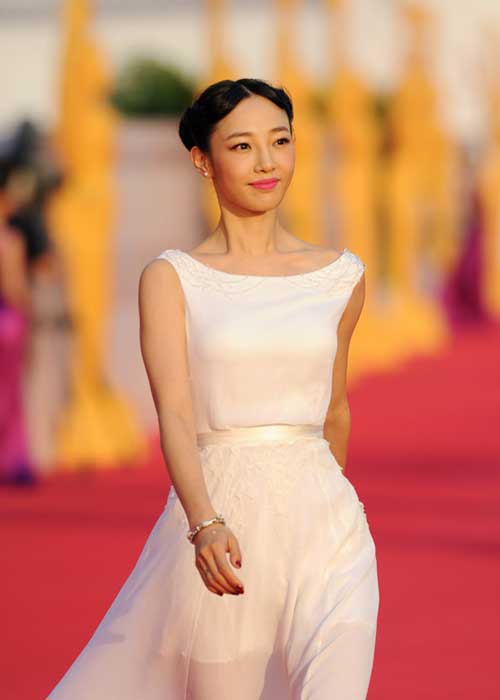 Actress Bai Baihe walks on the red carpet to attend the Award Ceremony of the 21st China Golden Rooster & Hundred Flowers Film Festival in Shaoxing City, east China's Zhejiang Province, Sept. 29, 2012. The festival, the largest film awards event in China, will close on Saturday night. Photo: Xinhua