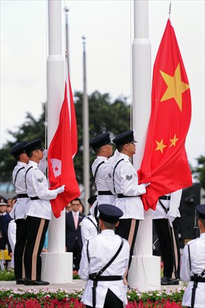 Honor guards prepare to hoist the Hong Kong and national flags during a flag-raising ceremony at Golden Bauhinia Square in Hong Kong on Monday to celebrate the 16th anniversary of the establishment of the Hong Kong Special Administrative Region. Photo: AFP