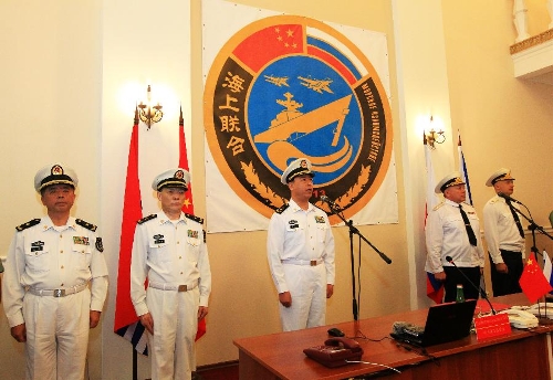 Ding Yiping, deputy commander of the Chinese Navy, announces the subject and content of the joint naval drills in Vladivostok, Russia, July 8, 2013. China and Russia started on Monday the joint naval drills off the coast of Russia's Far East. (Xinhua/Zha Chunming)  
