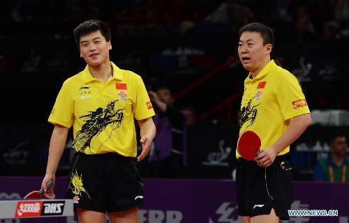  Hao Shuai and Ma Lin (R) of China react during the final of men's doubles against Chen Chien-An and Chuang Chih-Yuan of Chinese Taipei at the 2013 World Table Tennis Championships in Paris, France on May 19, 2013. Hao and Ma lost the match 2-4.(Xinhua/Tao Xiyi) 