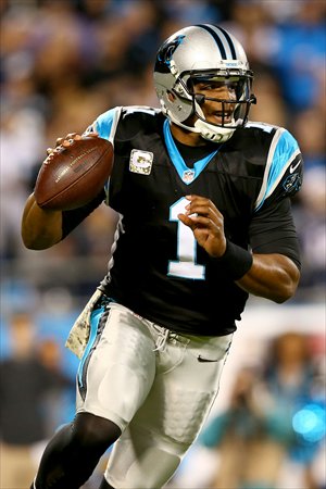 Cam Newton of the Carolina Panthers looks before throwing the ball, in a showdown with the New England Patriots on Monday. Photo: AFP