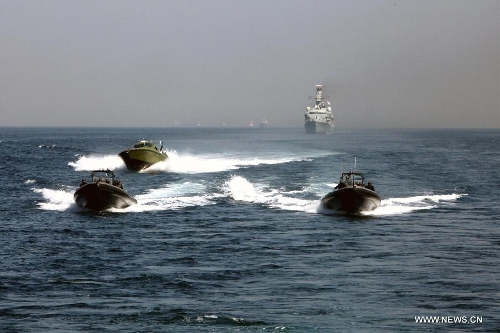 Pakistani powerboats are seen during the AMAN-13 exercise in the Arabian Sea, March 7, 2013. Naval ships from 14 countries, including China, the United States, Britain and Pakistan, joined a five-day naval drill in the Arabian Sea from March 4, involving 24 ships, 25 helicopters, and special forces. (Xinhua/Rao Rao) 