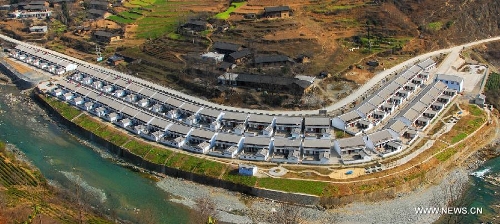 This bird eye view show the Longtanzi Village, Kangxian County in Longnan City, northwest China's Gansu Province, March 1, 2011. In the year of 2008, a massive earthquake occurred in Gansu's neighbouring province Sichuan, and Longnan was also battered by the disaster. During the past five years, a total of 3,905 reconstruction projects have been carried out in the city, where over 240,000 households have their houses rebuilt, and hundreds of schools and hospitals have been set up as well. (Xinhua/Wang Yaodong)