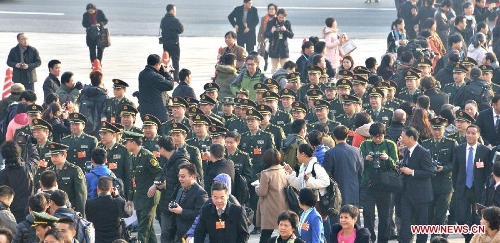 Deputies to the 12th National People's Congress (NPC) arrive at the Tian'anmen Square in Beijing, capital of China, March 5, 2013. The first session of the 12th National People's Congress (NPC) will open at the Great Hall of the People in Beijing on March 5. (Xinhua/Li Gang)