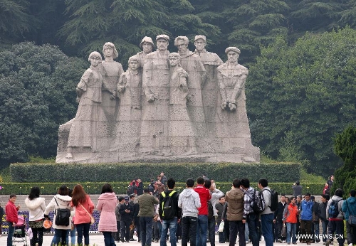 Visitors pay respect to the statues of martyrs at Yuhuatai Martyr Cemetery in Nanjing, capital of east China's Jiangsu Province, March 30, 2013. Various memorial ceremonies were held across the country to pay respect to martyrs ahead of the Qingming Festival, or Tomb Sweeping Day, which falls on April 4 this year. (Xinhua) 