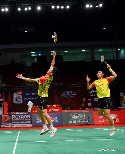 Cai Yun and Fu Haifeng (R) of China compete during the 2013 Sudirman Cup world mixed team badminton championship against Indonesia's Hendra Setiawan and Angga Pratama in Kuala Lumpur, Malaysia, on May 21, 2013. The Chinese pair won 2-1. (Xinhua/Chong Voon Chung) 