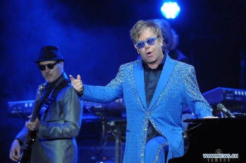 British singer Elton John performs during his concert at the Gran Parque Central in Montevideo, capital of Uruguay, March 4, 2013. (Xinhua/Nicolas Celaya) 