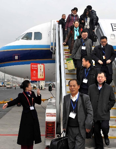 &nbsp;Deputies to the 12th National People's Congress (NPC) from northeast China's Heilongjiang Province arrive in Beijing, capital of China, March 2, 2013. The first session of the 12th NPC is scheduled to open in Beijing on March 5. (Xinhua/Wang Song) 
