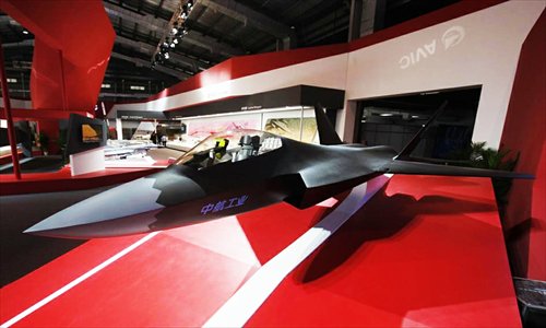 A stealth fighter J-31 model is displayed at the Aviation Industry Corporation of China (AVIC) exhibition hall at the Airshow China 2012 in Zhuhai, Guangdong Province on Monday. The show, now in its ninth year, runs until November 18. Photo: huanqiu.com
