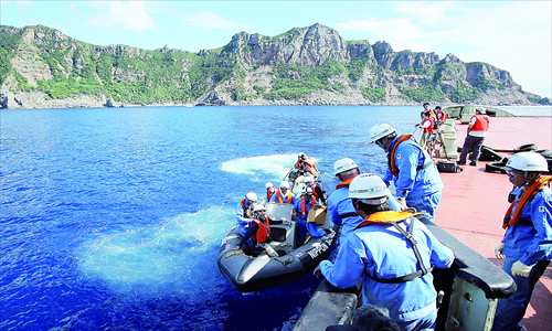 This file picture taken on September 2 shows a team of Japanese surveyors on a rubber boat heading to the Diaoyu Islands. Photo: AFP