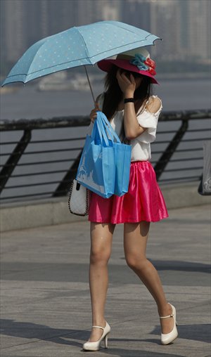 Functional and stylish parasols offer skin protection to Shanghai fashionistas. Photos: IC and CFP