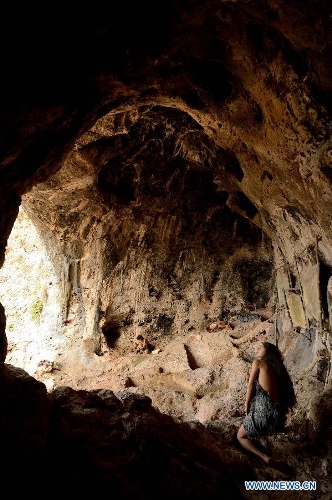 picture taken on May 19, 2013, shows a reconstructed habitation of the Mousterian culture (about 100,000 to 40,000 B.C.) in Jamal Cave on the western slopes of the Mount Carmel range near Israeli northern city of Haifa. Sites of human evolution at Mount Carmel, including the caves of Tabun, Jamal, el-Wad and Skhul, were recognized as World Heritage Site by United Nations Educational, Scientific and Cultural Organization in 2012. (Xinhua/Yin Dongxun)