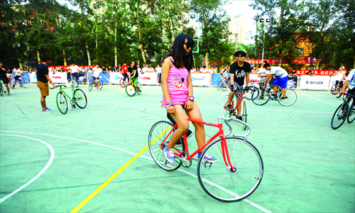 2. A woman competes in an event to test who can balance in a stationary position for the longest. 

