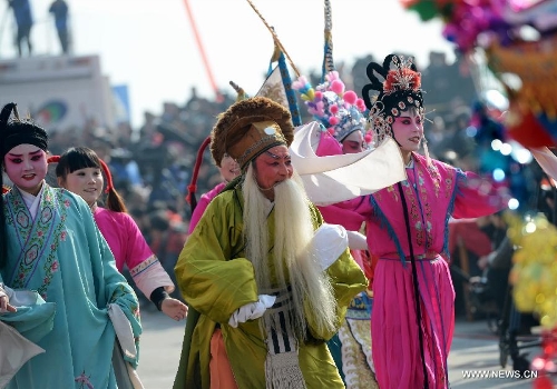 Performers take part in a Shehuo parade in Longxian County, northwest China's Shanxi Province, Feb. 22, 2013. The performance of Shehuo can be traced back to ancient rituals to worship the earth, which they believe could bring good harvests and fortunes in return. Most Shehuo performances take place around traditional Chinese festivals, especially the Spring Festival and the Lantern Festival. (Xinhua/Li Yibo) 