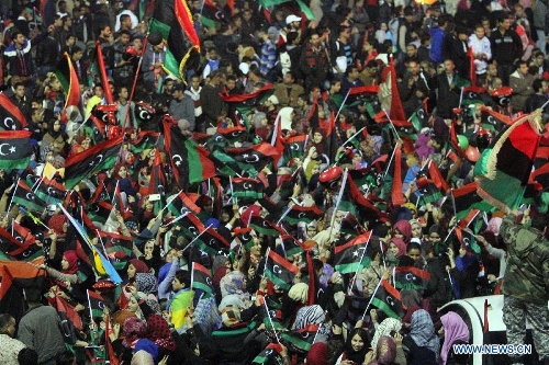 &nbsp;People gather to enjoy the fireworks during a celebration for the second anniversary of the Libyan uprising at the Martyrs' Square in Tripoli on Feb. 17, 2013. (Xinhua/Hamza Turkia) 