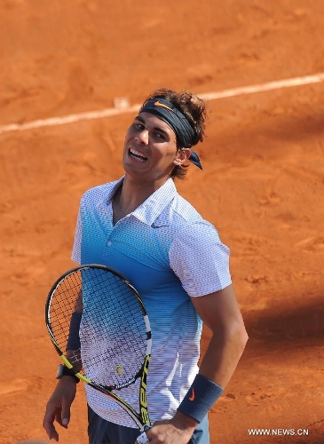 Spanish tennis player Rafael Nadal reacts during an ATP Vina del Mar tournament doubles match with Argentine Juan Monaco against Czech Republic's Frantisek Cermank and Lukas Dlouhy in Vina del Mar, Valparaiso Region, Chile, Feb. 5, 2013. (Xinhua/Jorge Villegas) 