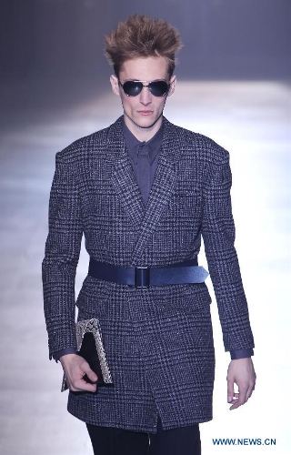 A model displays creations by Japanese designer Arashi Yanagawa for the label John Lawrence Sullivan during the men's Fall-Winter 2013-2014 collection show in Paris, France, Jan. 16, 2013. The 5-day Paris Men's Fashion Week kicked off here on Wednesday. (Xinhua/Gao Jing) 