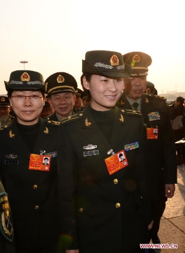 Liu Yang (front), a deputy to the 12th National People's Congress (NPC) arrives at the Tian'anmen Square in Beijing, capital of China, March 5, 2013. The first session of the 12th National People's Congress (NPC) will open at the Great Hall of the People in Beijing on March 5. (Xinhua/Jin Liangkuai)